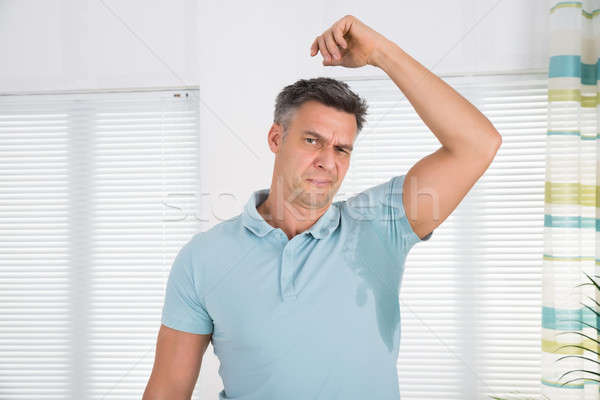 Man Sweating Very Badly Under Armpit Stock photo © AndreyPopov