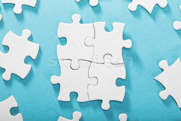 White Jigsaw Puzzles On Blue Background Stock photo © AndreyPopov