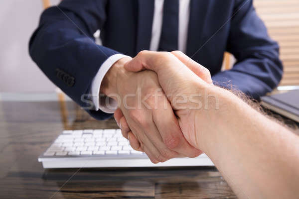 Businessman Shaking Hand With His Partner Stock photo © AndreyPopov