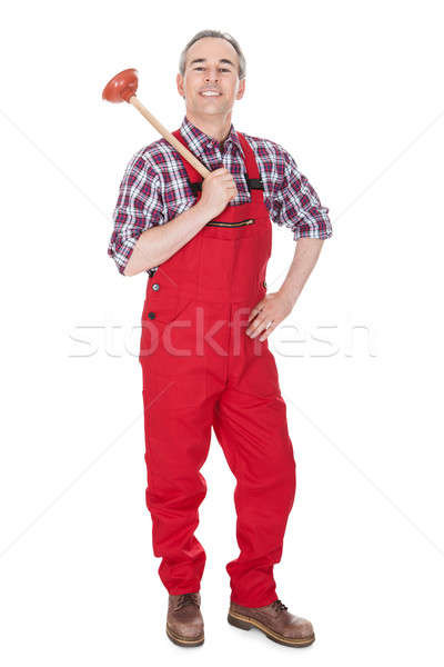 Portrait Of Male Plumber Holding Plunger Stock photo © AndreyPopov