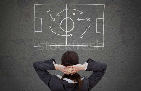 Businesswoman Looking At Strategically Game Plan Stock photo © AndreyPopov