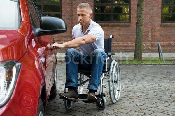 Handicapped Man Opening Door Of A Car Stock photo © AndreyPopov