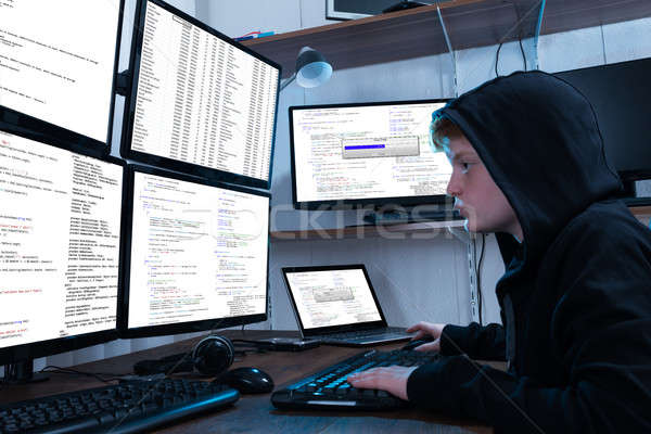 Boy Programming On Computer With Multiple Monitors Stock photo © AndreyPopov