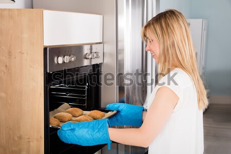 Woman Enjoy Eating Sweet Food In Kitchen Stock photo © AndreyPopov