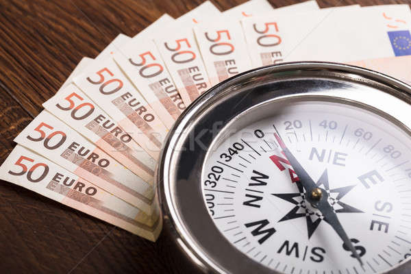 Compass On Euro Note Stock photo © AndreyPopov