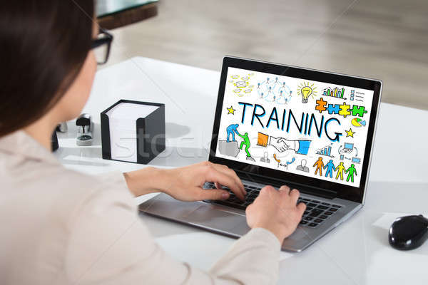 Businesswoman Using Laptop Showing Training Concept Stock photo © AndreyPopov