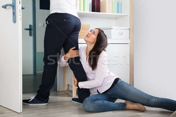 Woman Stopping The Man From Leaving Her Stock photo © AndreyPopov