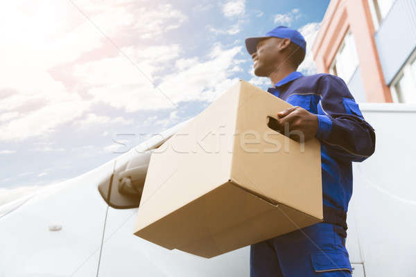 Loader Man With Cardboard Box Stock photo © AndreyPopov