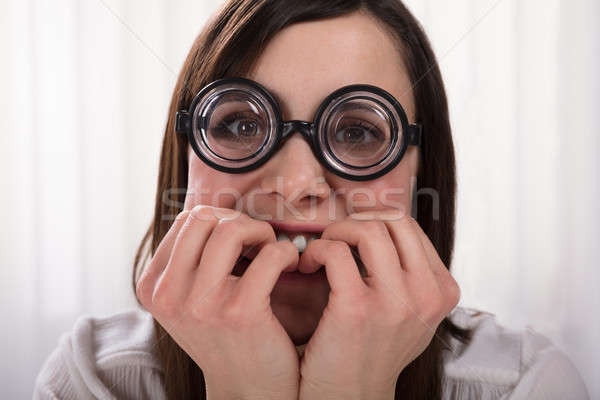 Stréber nő harap körmök visel szemüveg Stock fotó © AndreyPopov