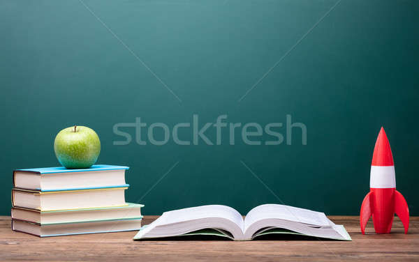 Fresh Apple, Books And Rocket On Desk Stock photo © AndreyPopov