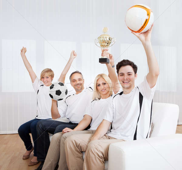 Ecstatic family celebrating a win Stock photo © AndreyPopov