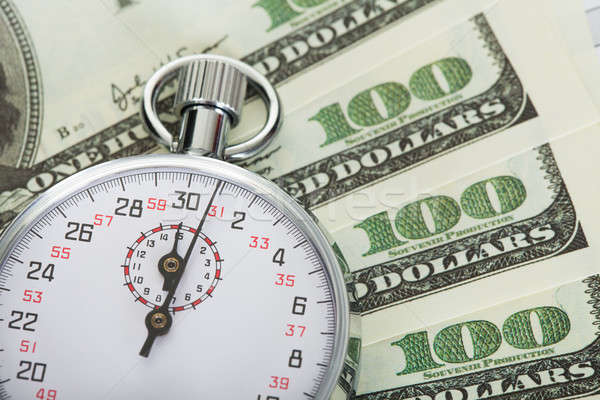Il tempo è denaro cronometro dollari successo bianco contanti Foto d'archivio © AndreyPopov