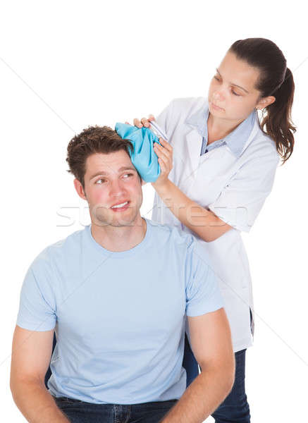 Doctor Giving Treatment To Patient Stock photo © AndreyPopov