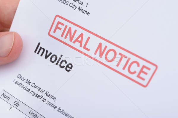Man Holding Invoice With Final Notice Stamp Stock photo © AndreyPopov