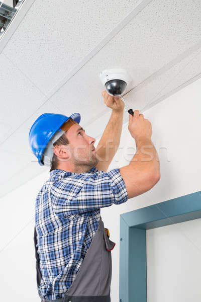 Technician Adjusting Cctv Camera Stock photo © AndreyPopov