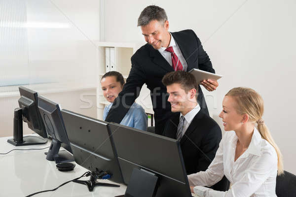 Hoogleraar tonen computers mannelijke bureau Stockfoto © AndreyPopov