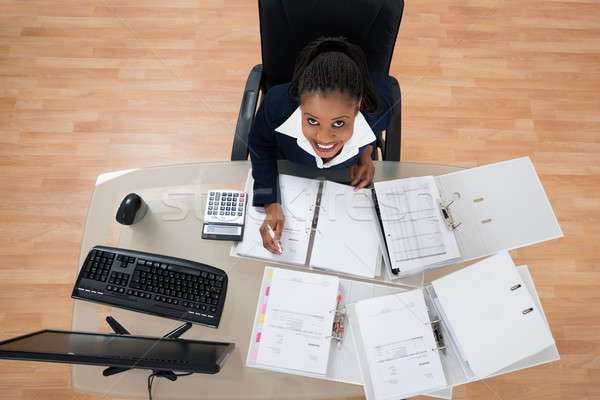 Businesswoman Calculating Bills Stock photo © AndreyPopov