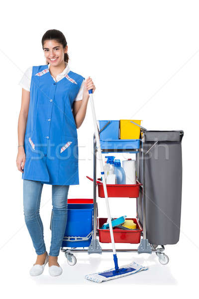Happy Female Janitor Mopping By Trolley On White Background Stock photo © AndreyPopov