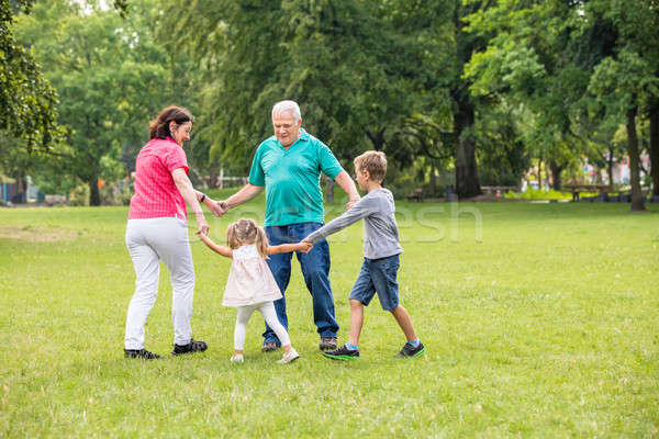 Grands-parents jouer petits enfants heureux âgées [[stock_photo]] © AndreyPopov