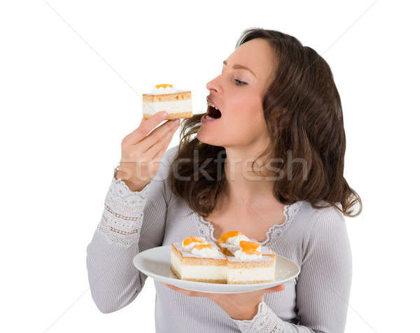 Stockfoto: Jonge · vrouw · eten · stuk · cake · witte
