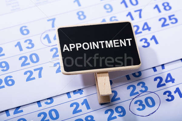 Wooden Miniature Appointment Placard On Calendar Stock photo © AndreyPopov