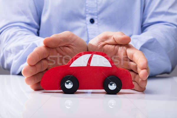 Person Protecting Red Car Stock photo © AndreyPopov