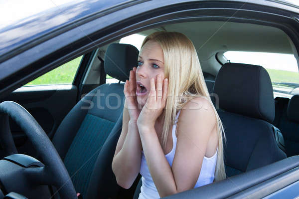 Stock photo: Woman Sitting In Car Screaming