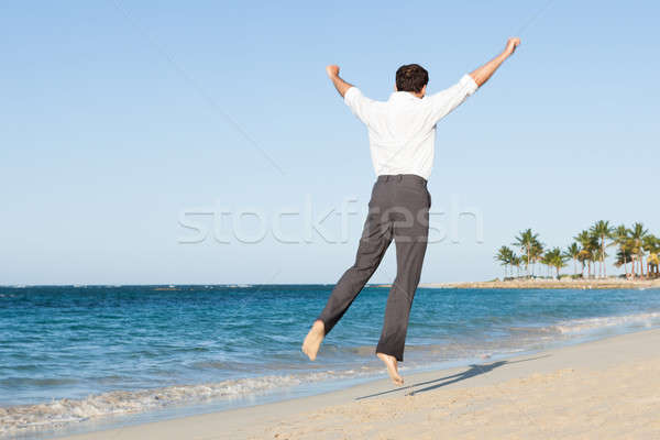 Foto stock: Hombre · saltar · playa · feliz · agua