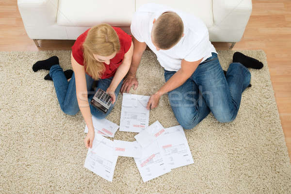 Stock photo: Couple With Bills And Calculator
