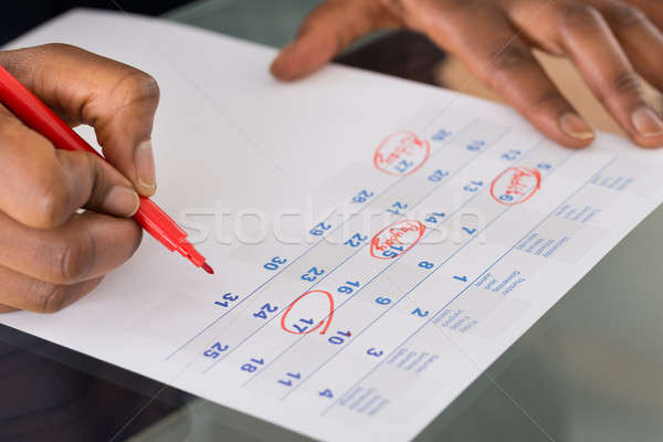 Person Marking Important Date On Calendar Stock photo © AndreyPopov
