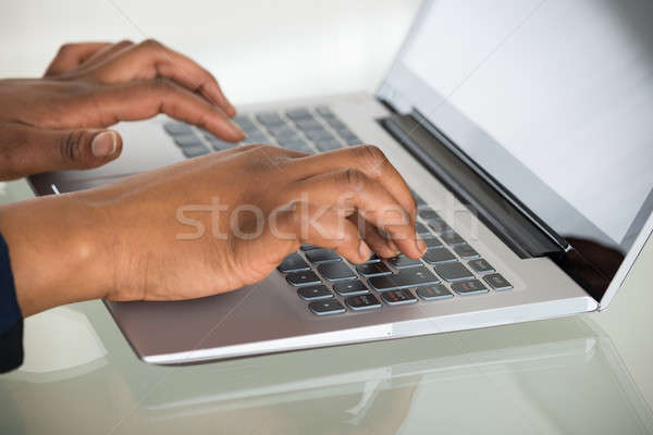 Person's Hand Using Laptop Stock photo © AndreyPopov