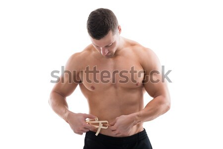 Muscular Man Measuring Fats With Caliper Stock photo © AndreyPopov