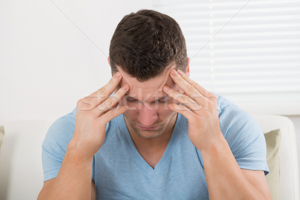 Hombre sufrimiento dolor de cabeza casa preocupado adulto Foto stock © AndreyPopov