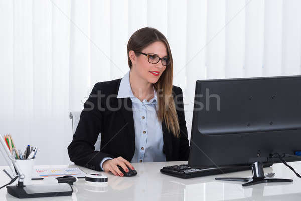 Businesswoman Using Computer Stock photo © AndreyPopov