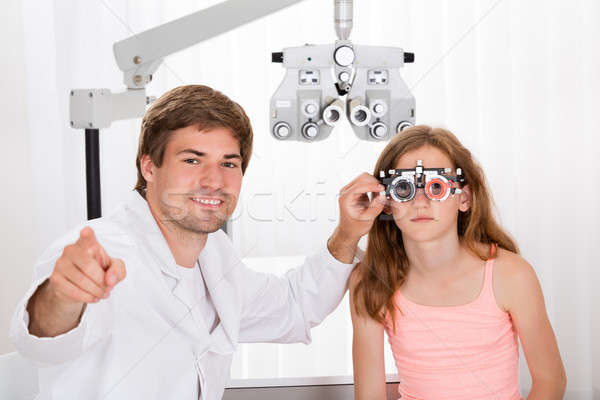 Optométriste filles vision jeunes Homme oeil [[stock_photo]] © AndreyPopov