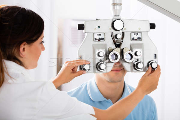 Kadın optometrist hasta erkek klinik göz Stok fotoğraf © AndreyPopov