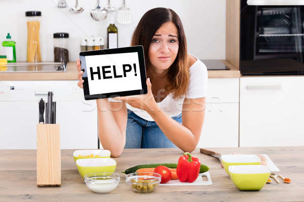 Woman Holding Digital Tablet Showing Help Text Stock photo © AndreyPopov