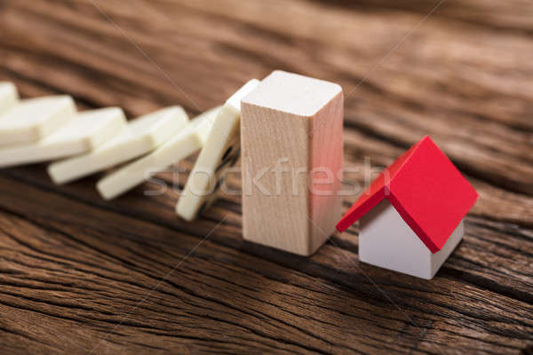 Block Stopping Domino Pieces Representing Home Insurance Stock photo © AndreyPopov