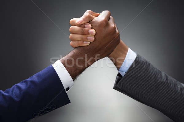Dwa biznesmen armwrestling szary Zdjęcia stock © AndreyPopov