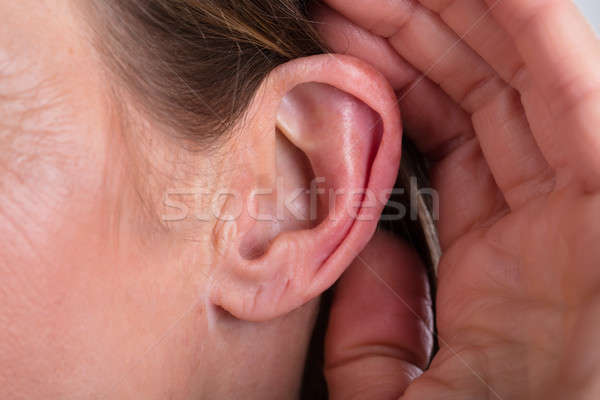 Female Hand On An Ear Stock photo © AndreyPopov