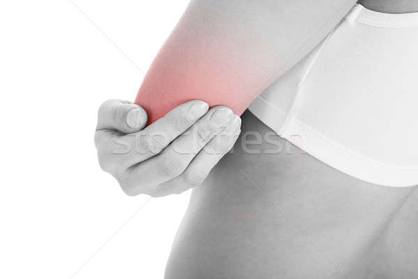 Woman with elbow pain Stock photo © AndreyPopov