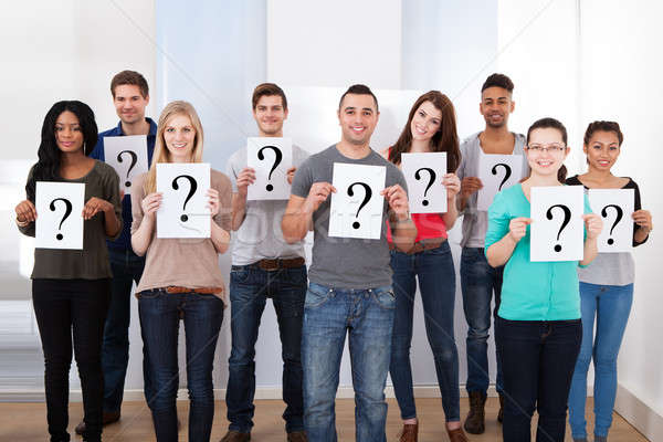 College Students Holding Question Mark Signs Stock photo © AndreyPopov