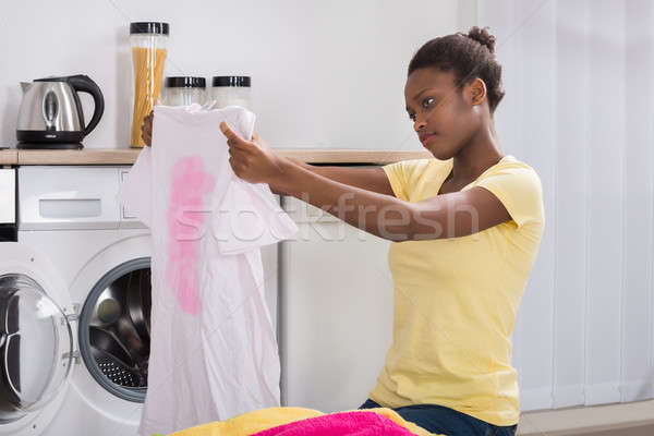 Stock photo: Woman Looking At Stained Cloth