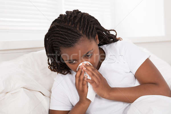 Stock photo: Girl Blowing Her Nose With Tissue