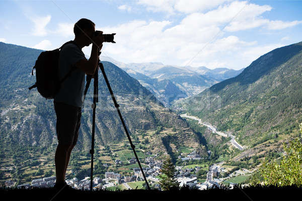 Silhouette Of A Man Photographing Montains Stock photo © AndreyPopov