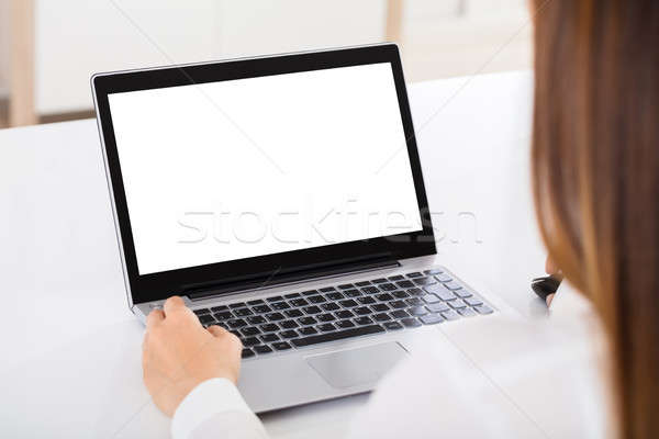 Businesswoman Working On Laptop Stock photo © AndreyPopov