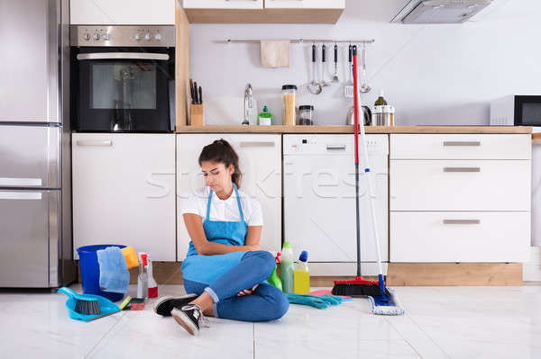 Young Woman Sitting On Kitchen Floor Stock photo © AndreyPopov