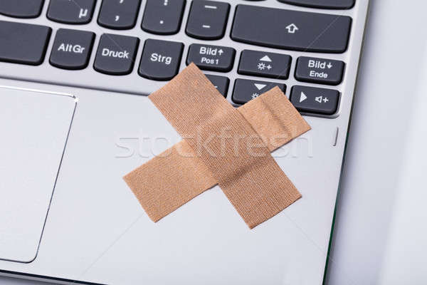 Laptop Keypad With Cross Band Aid Stock photo © AndreyPopov