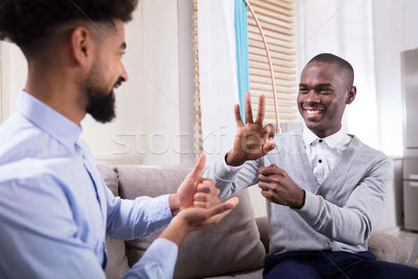 два счастливым мужчин язык жестов молодые Сток-фото © AndreyPopov