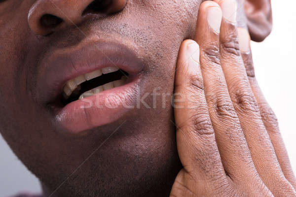 Om durere de dinti alb femeie mână Imagine de stoc © AndreyPopov